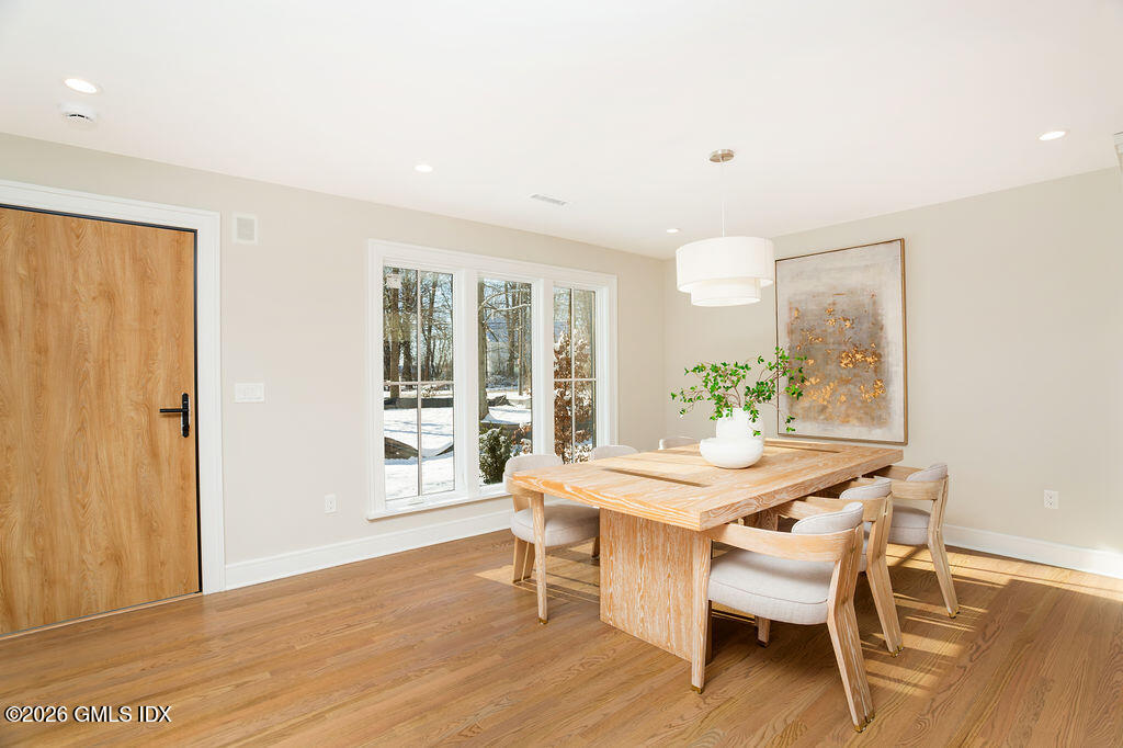 49 Salisbury Road Darien, CT 06820 - Photo 5 of 40 a dining room with furniture and wooden floor