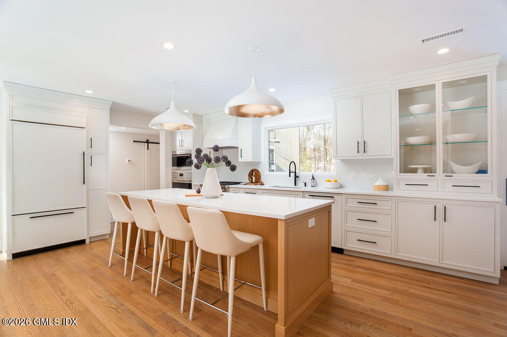 49 Salisbury Road Darien, CT 06820 - Photo 8 of 40 a kitchen with white cabinets and counter space