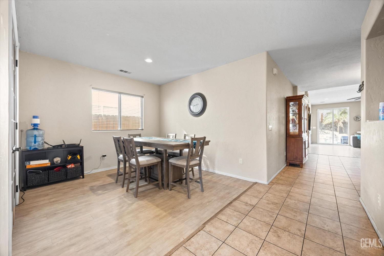 Undisclosed Address Bakersfield, CA 93313 - Photo 4 of 24 a view of a dining room with furniture and chandelier