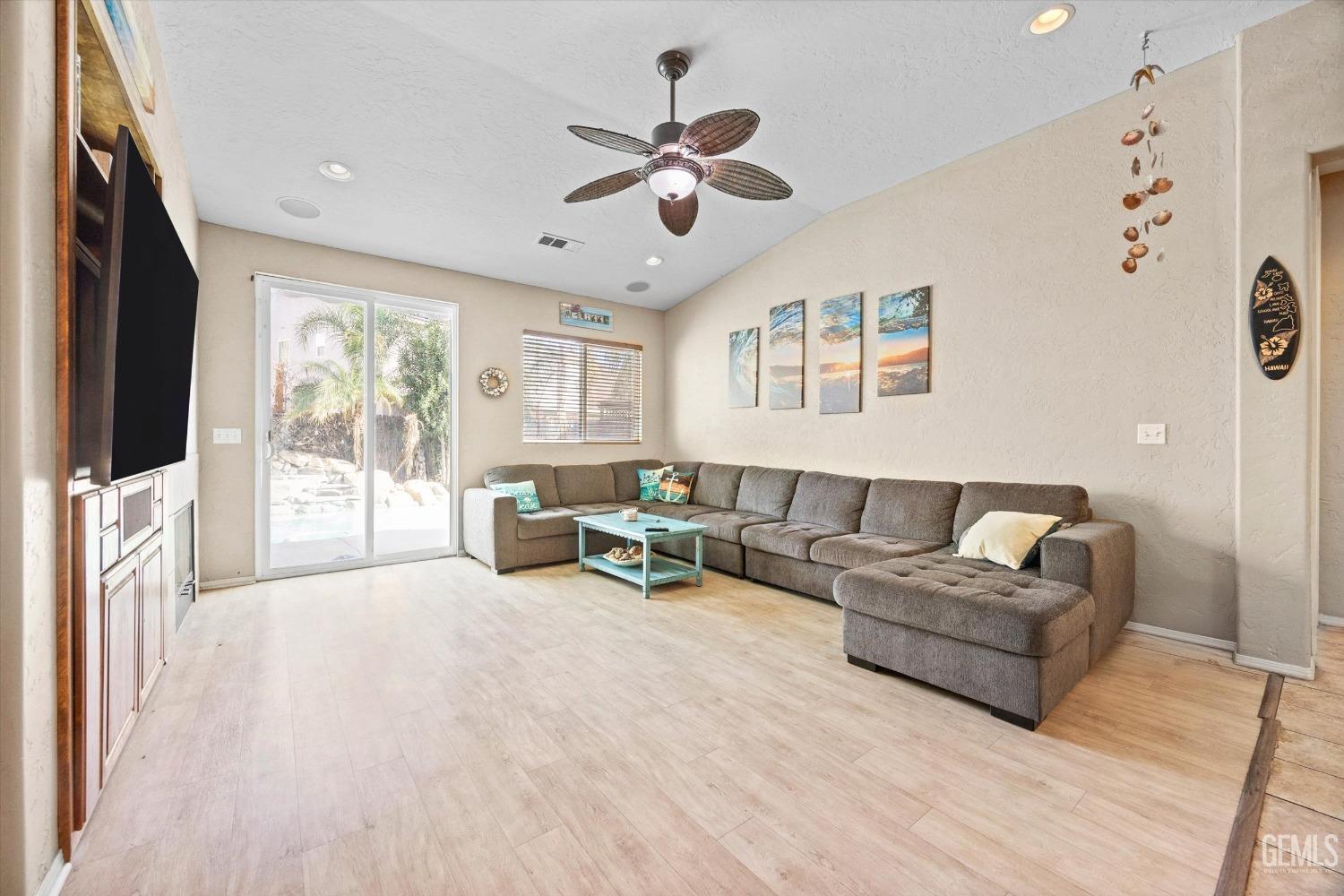 Undisclosed Address Bakersfield, CA 93313 - Photo 7 of 24 a living room with furniture and a flat screen tv