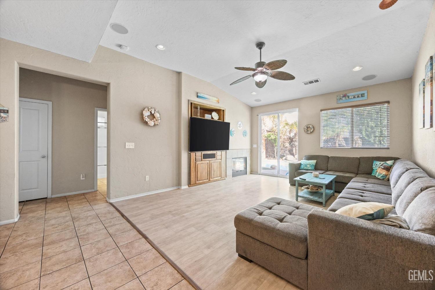 Undisclosed Address Bakersfield, CA 93313 - Photo 9 of 24 a living room with furniture and a flat screen tv