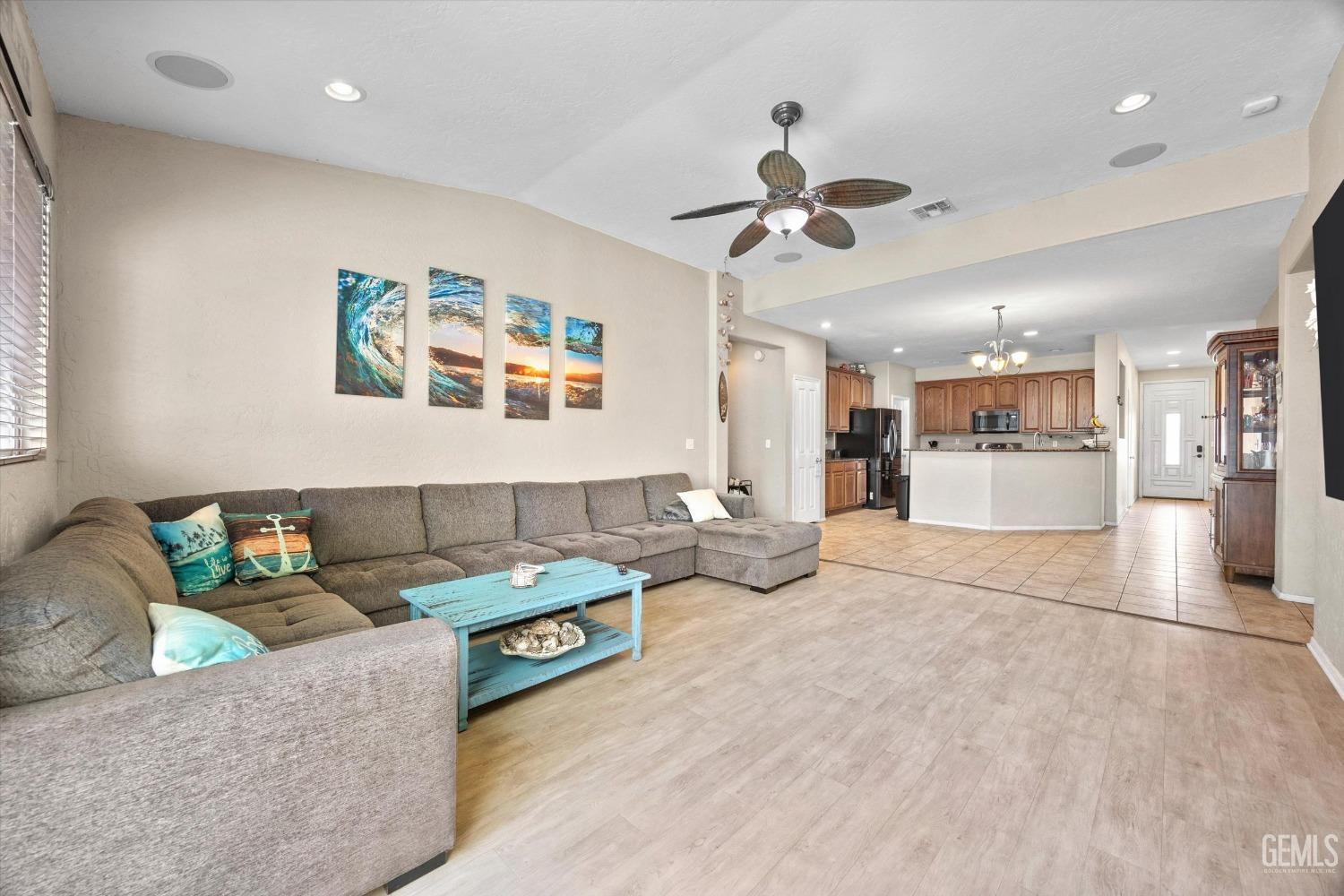Undisclosed Address Bakersfield, CA 93313 - Photo 10 of 24 a living room with furniture and a chandelier