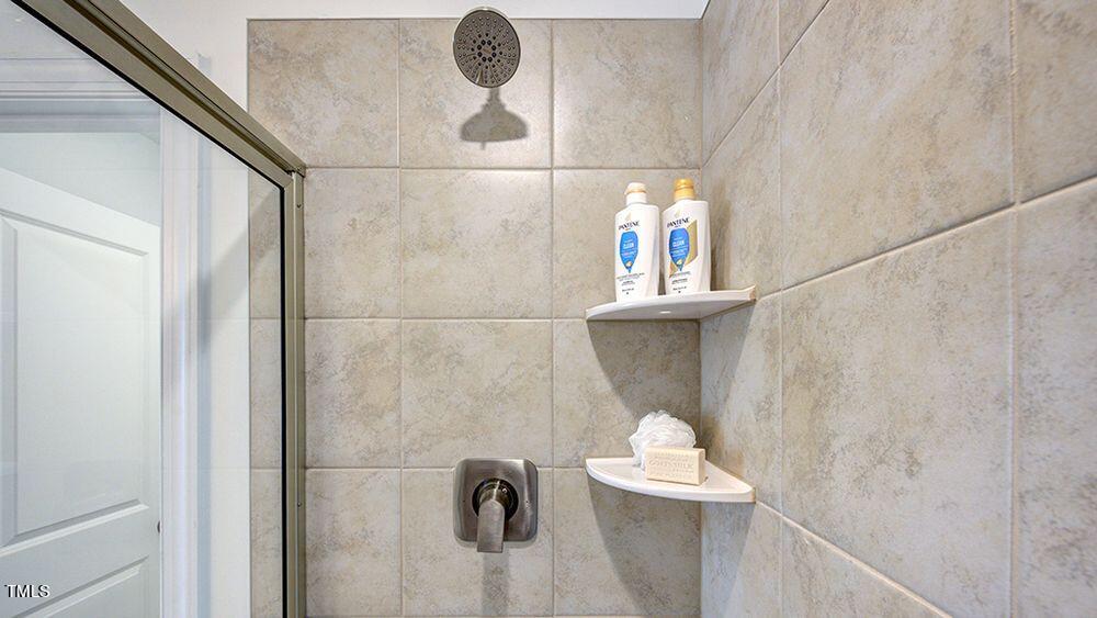 281 Hank Way Angier, NC 27501 - Photo 11 of 15 a bathroom with a shower