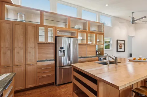 a kitchen with stainless steel appliances refrigerator and cabinets