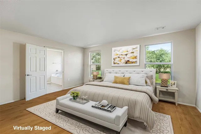 a bedroom with a bed and a couch