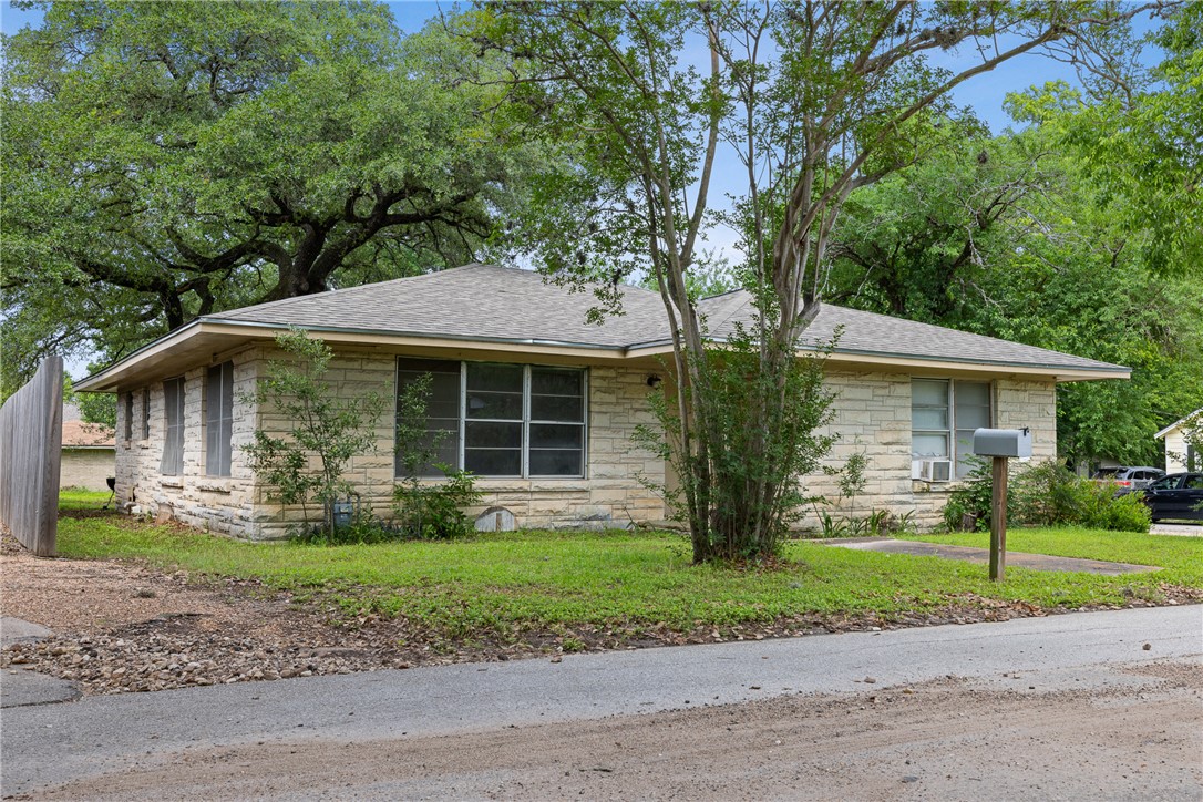814 East 28th Street Bryan, TX 77803 - Photo 1 of 1 View of front of home featuring stone siding, a fr