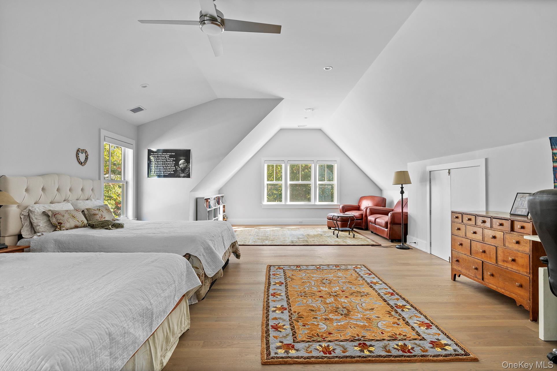 41 Arbutus Road Quogue, NY 11959 - Photo 30 of 35 a spacious bedroom with a bed couch and a window