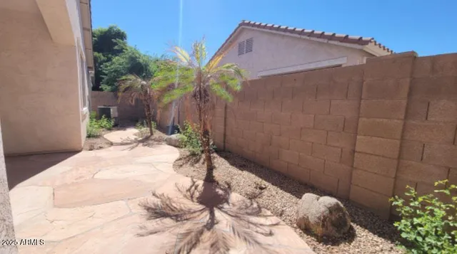 a view of a backyard of the house