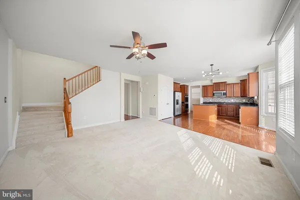 a view of a kitchen with furniture and a kitchen view