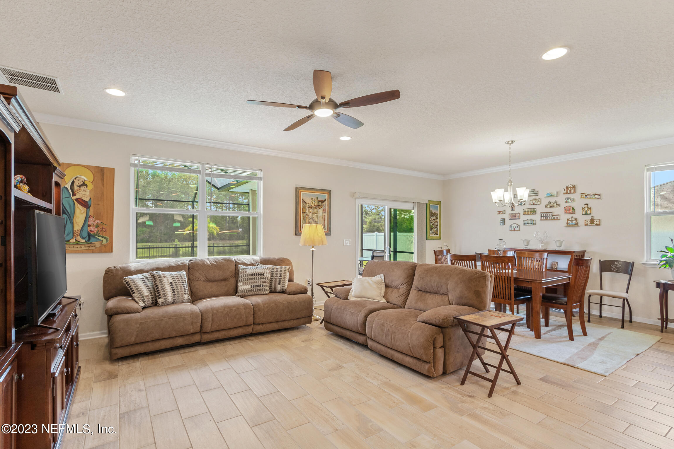 57 Deer Crossing Road St. Augustine, FL 32086 - Photo 13 of 48 a living room with furniture and a large window