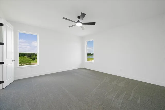 a spacious bathroom with a granite countertop sink a mirror a shower and a bathtub