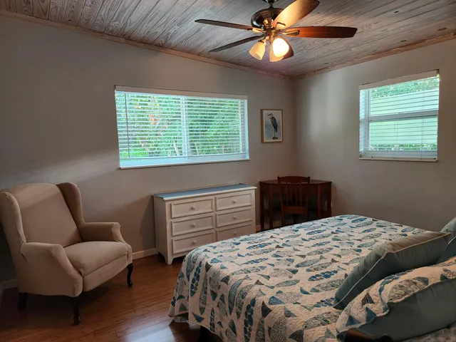 a bedroom with a bed and a couch