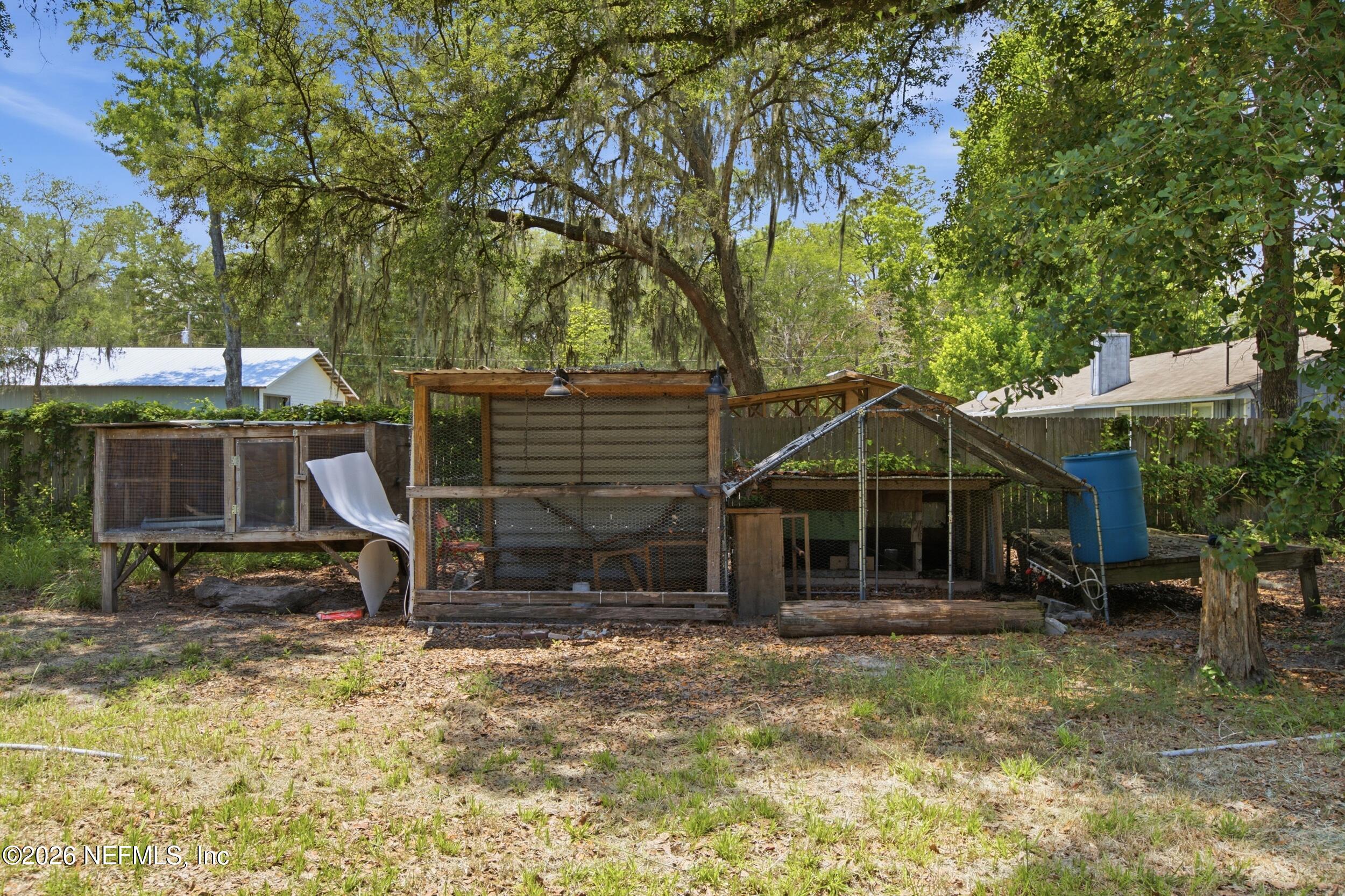 5667 Long Branch Cemetery Road Jacksonville, FL 32234 - Photo 20 of 24 a view of a house with backyard