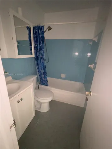 a bathroom with a toilet a sink and bathtub