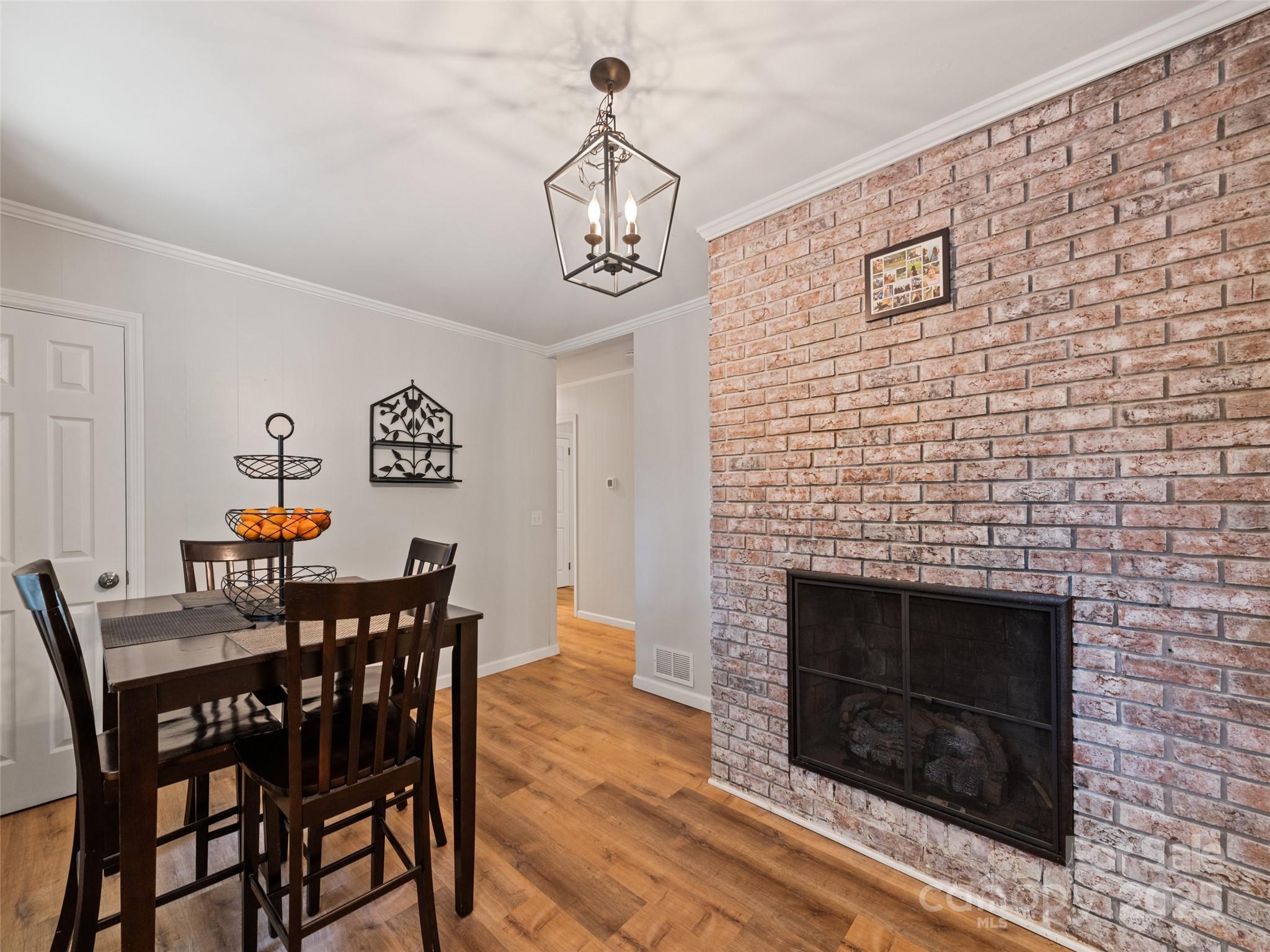 263 Blanton Street Columbus, NC 28722 - Photo 18 of 45 a view of a dining room with furniture and wooden floor