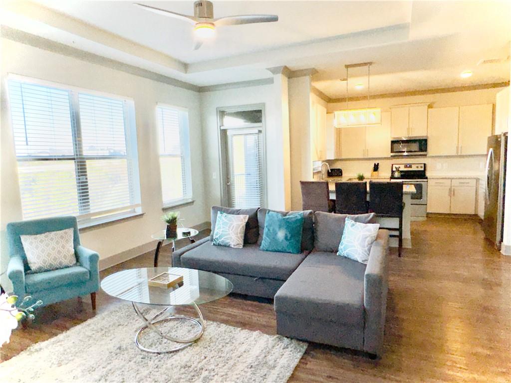 a living room with furniture and a table