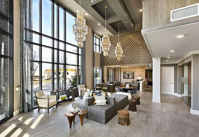 a kitchen with kitchen island a stove and a sink