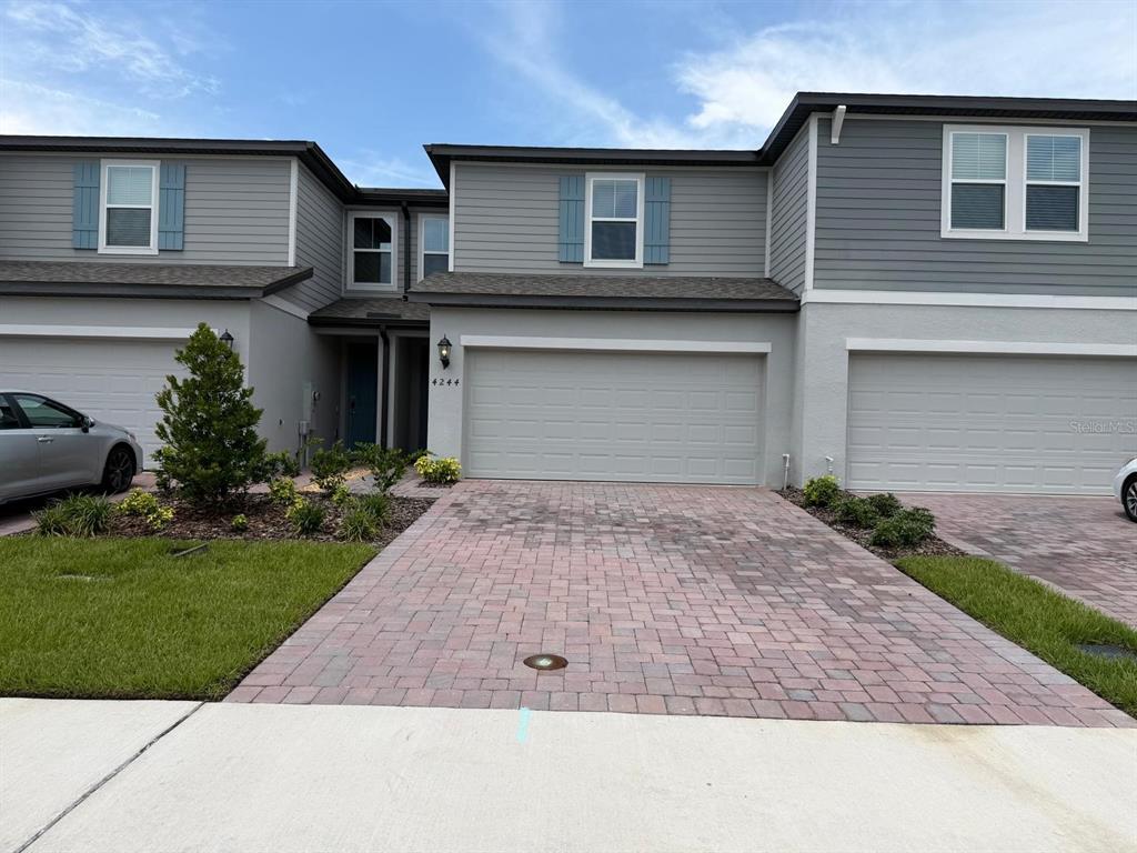 4244 Ranch House Road St. Cloud, FL 34772 - Photo 1 of 34 a front view of house with yard