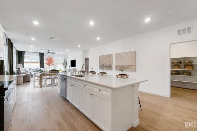 a kitchen with lots of counter top space and living room