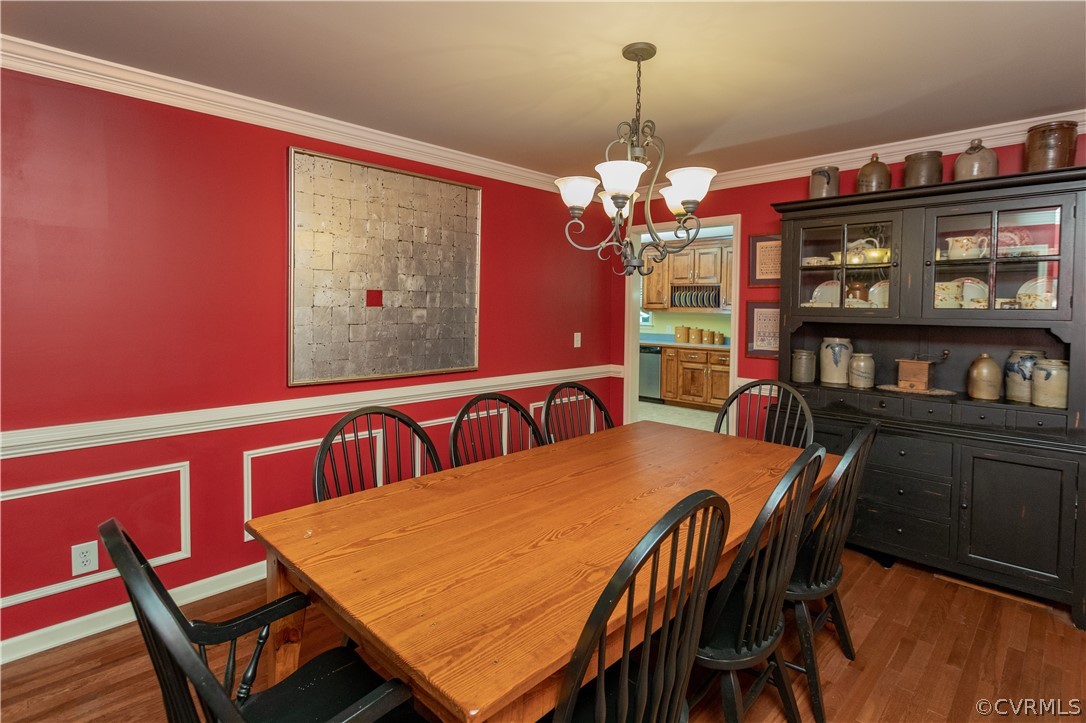 1286 Fletcher Chapel Road Kenbridge, VA 23944 - Photo 11 of 48 a view of a dining room with furniture and a chandelier