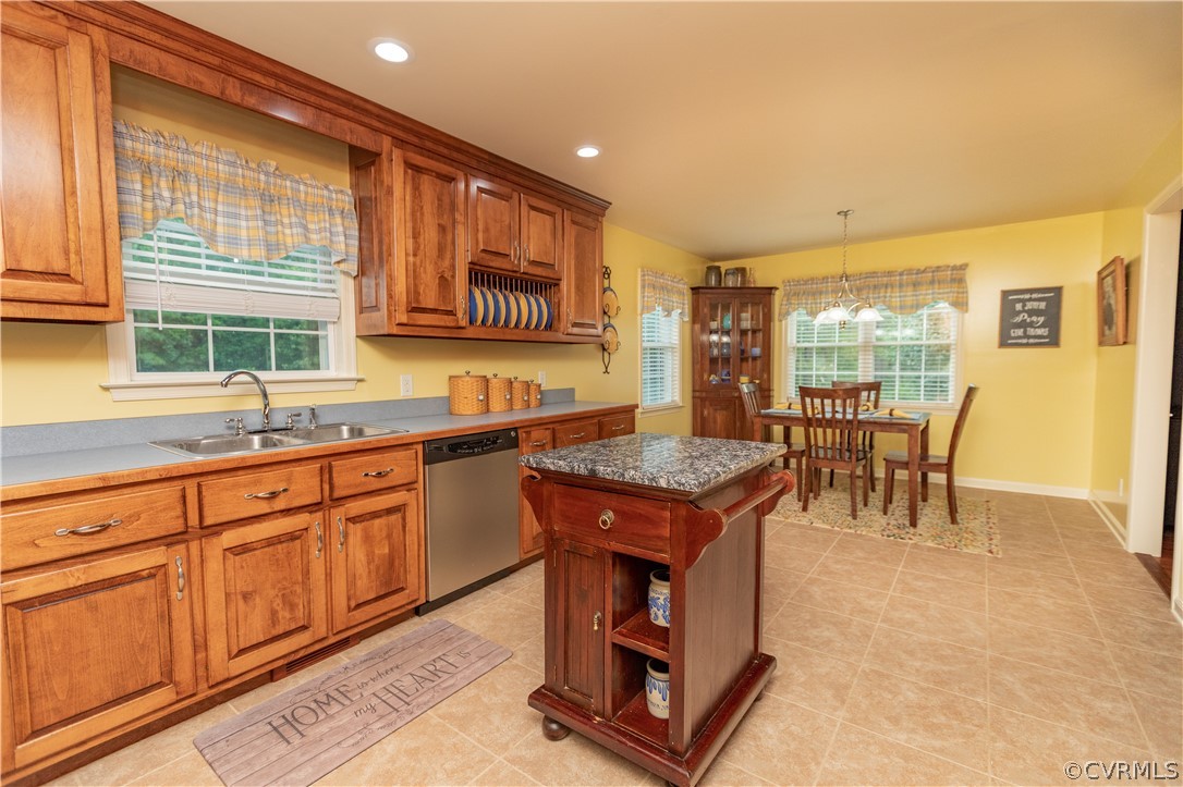 1286 Fletcher Chapel Road Kenbridge, VA 23944 - Photo 19 of 48 a kitchen with granite countertop sink and wooden cabinets