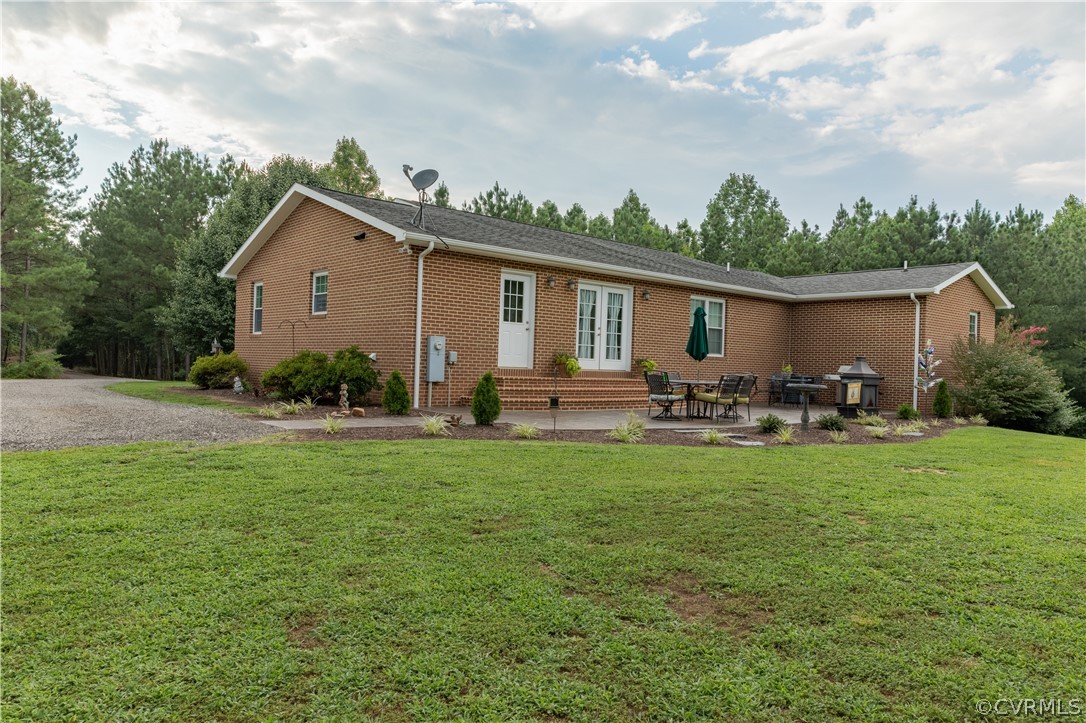 1286 Fletcher Chapel Road Kenbridge, VA 23944 - Photo 3 of 48 a front view of house with yard and outdoor seating