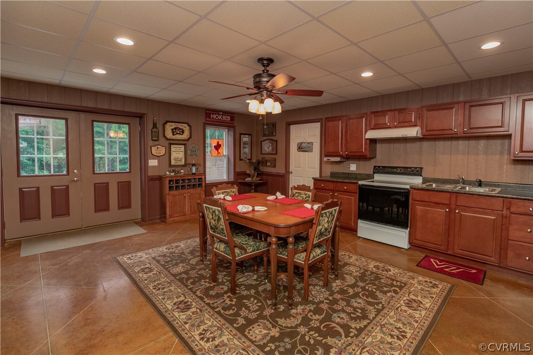 1286 Fletcher Chapel Road Kenbridge, VA 23944 - Photo 34 of 48 a dining room with wooden floor and chandelier