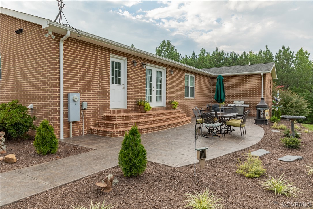 1286 Fletcher Chapel Road Kenbridge, VA 23944 - Photo 4 of 48 a view of a backyard with sitting area