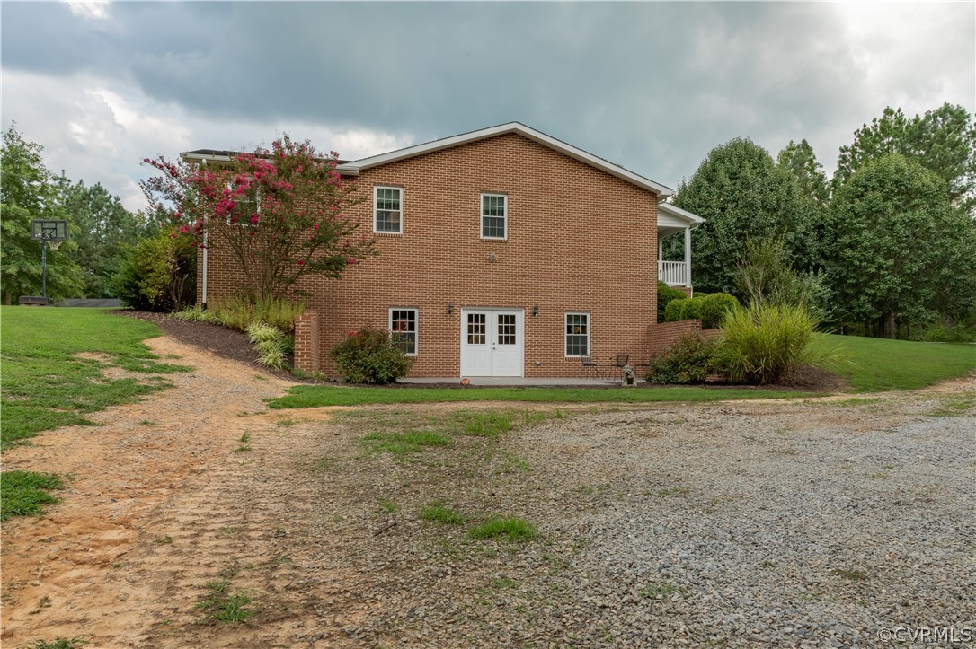 1286 Fletcher Chapel Road Kenbridge, VA 23944 - Photo 6 of 48 a view of a house with backyard and trees