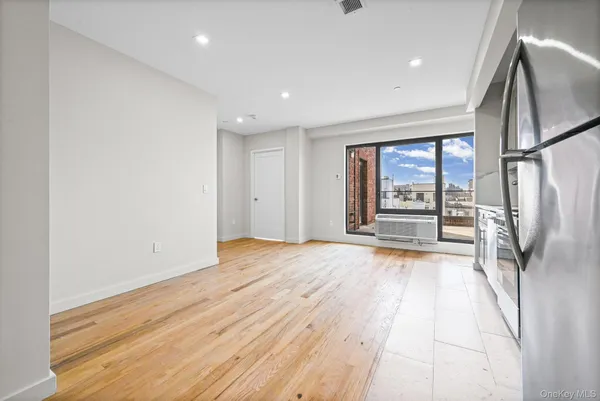 a view of an empty room with a fireplace