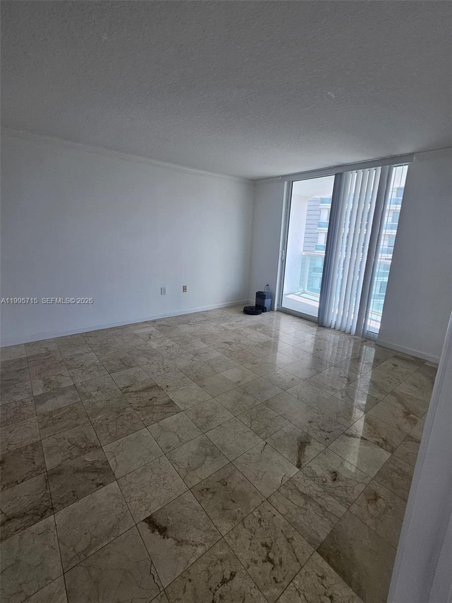 2101 Brickell Avenue, Unit 2111 Miami, FL 33129 - Photo 2 of 16 a view of an empty room and window