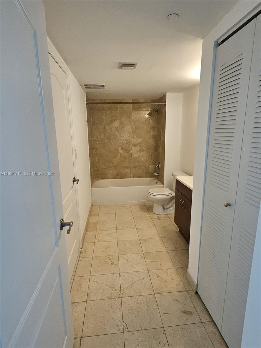 2101 Brickell Avenue, Unit 2111 Miami, FL 33129 - Photo 9 of 16 a bathroom with a glass door shower