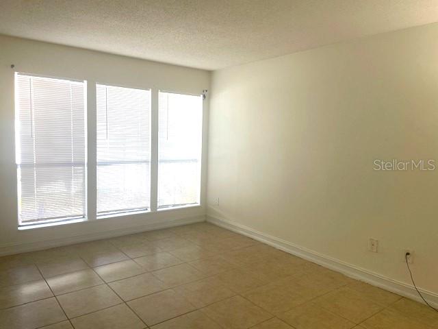 3461 Clark Road, Unit 160 Sarasota, FL 34231 - Photo 12 of 21 an empty room with a window