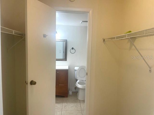 3461 Clark Road, Unit 160 Sarasota, FL 34231 - Photo 14 of 21 a bathroom with a granite countertop shower and a toilet