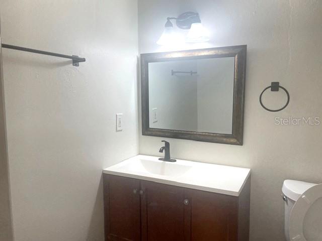 3461 Clark Road, Unit 160 Sarasota, FL 34231 - Photo 15 of 21 a bathroom with a sink vanity and toilet
