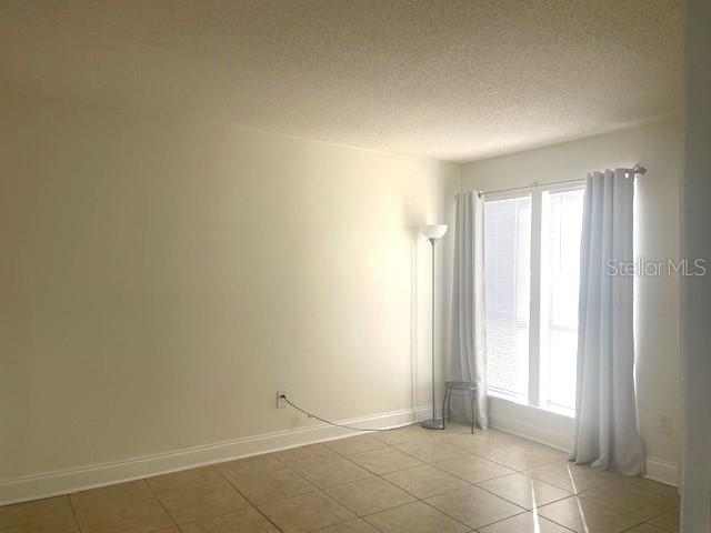 3461 Clark Road, Unit 160 Sarasota, FL 34231 - Photo 17 of 21 an empty room with windows