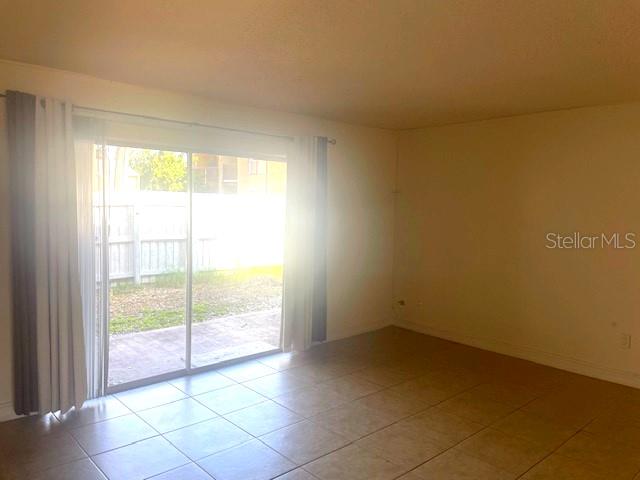 3461 Clark Road, Unit 160 Sarasota, FL 34231 - Photo 2 of 21 a view of an empty room with a window
