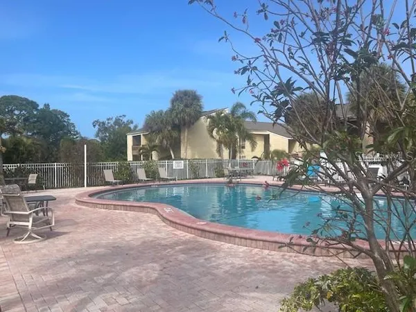a view of a swimming pool with a patio