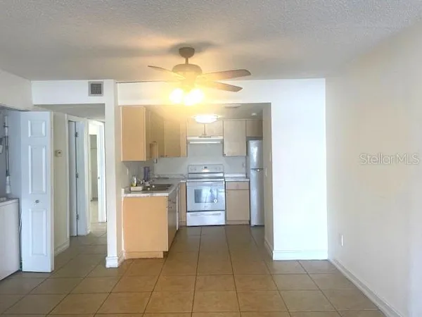 a kitchen with a cabinets and appliances