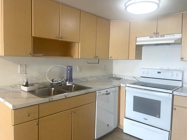 3461 Clark Road, Unit 160 Sarasota, FL 34231 - Photo 8 of 21 a kitchen with granite countertop cabinets stainless steel appliances and sink