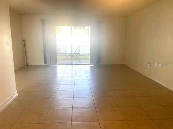 a view of an empty room and window