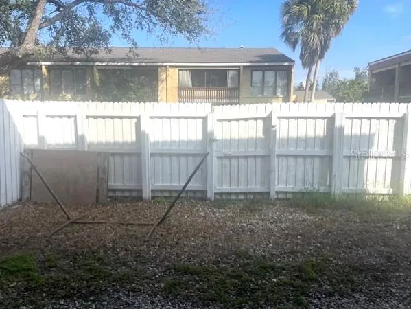 a view of backyard with small cabin