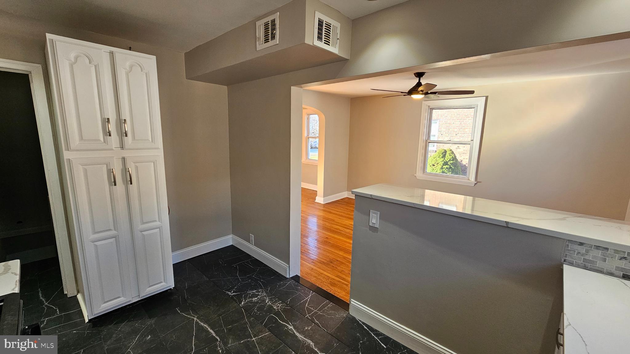 825 Laurel Road Lansdowne, PA 19050 - Photo 14 of 35 a view of hallway with window and wooden floor