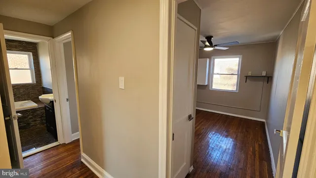 a view of front door with wooden floor