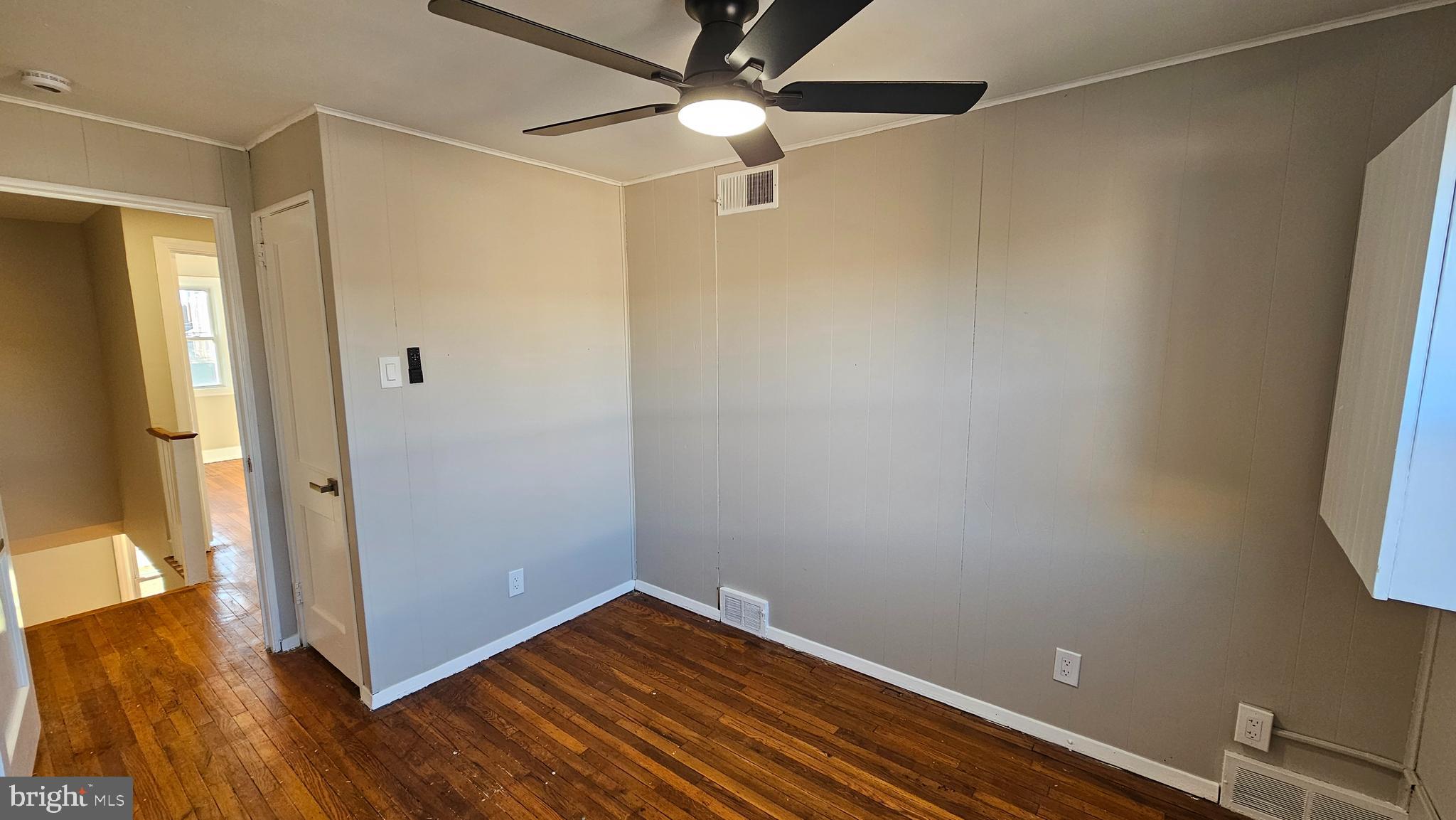825 Laurel Road Lansdowne, PA 19050 - Photo 18 of 35 a view of a room with wooden floor and a window