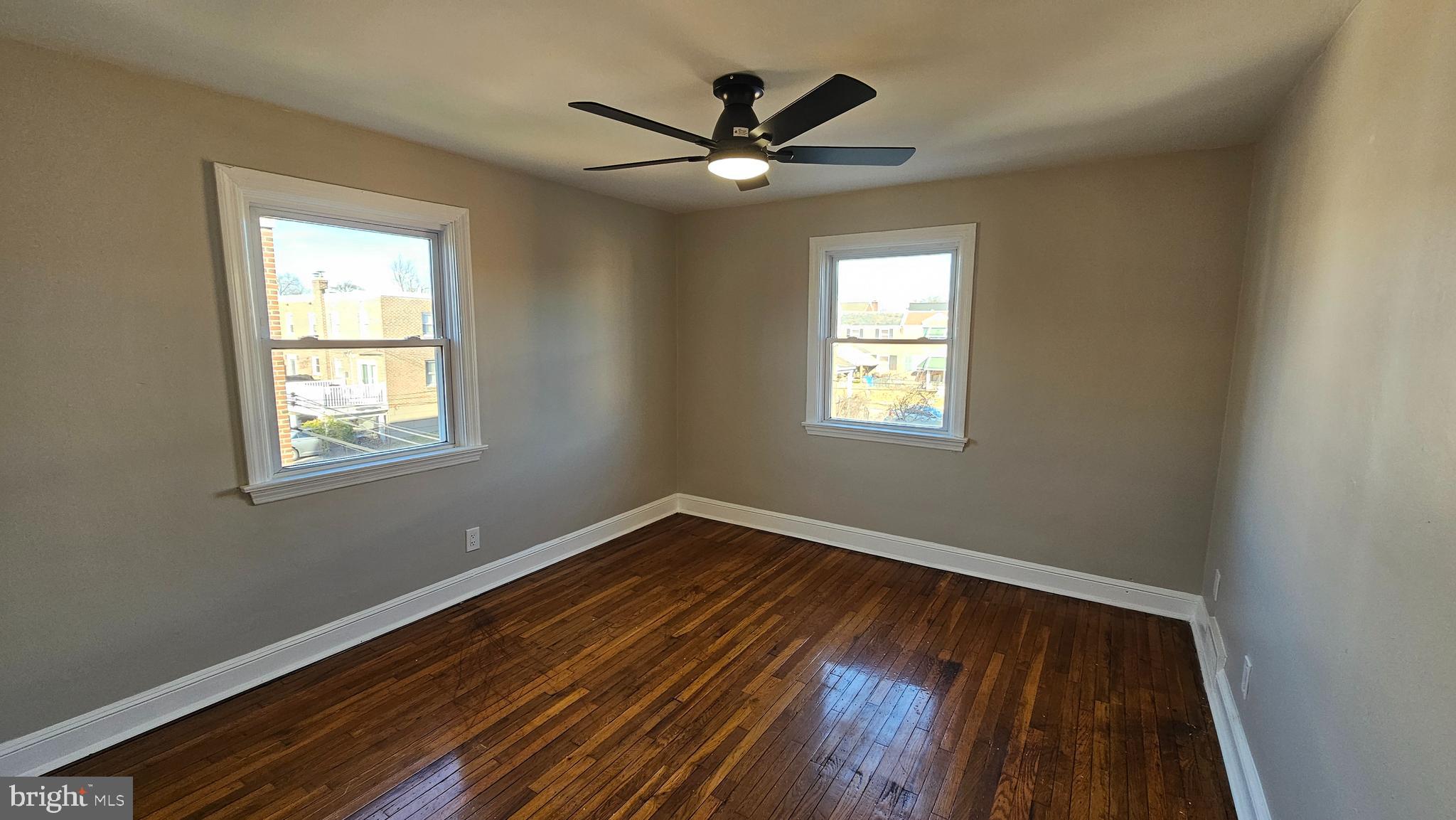 825 Laurel Road Lansdowne, PA 19050 - Photo 21 of 35 a view of an empty room with wooden floor and a window