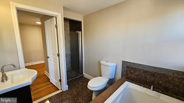 a bathroom with a sink and toilet