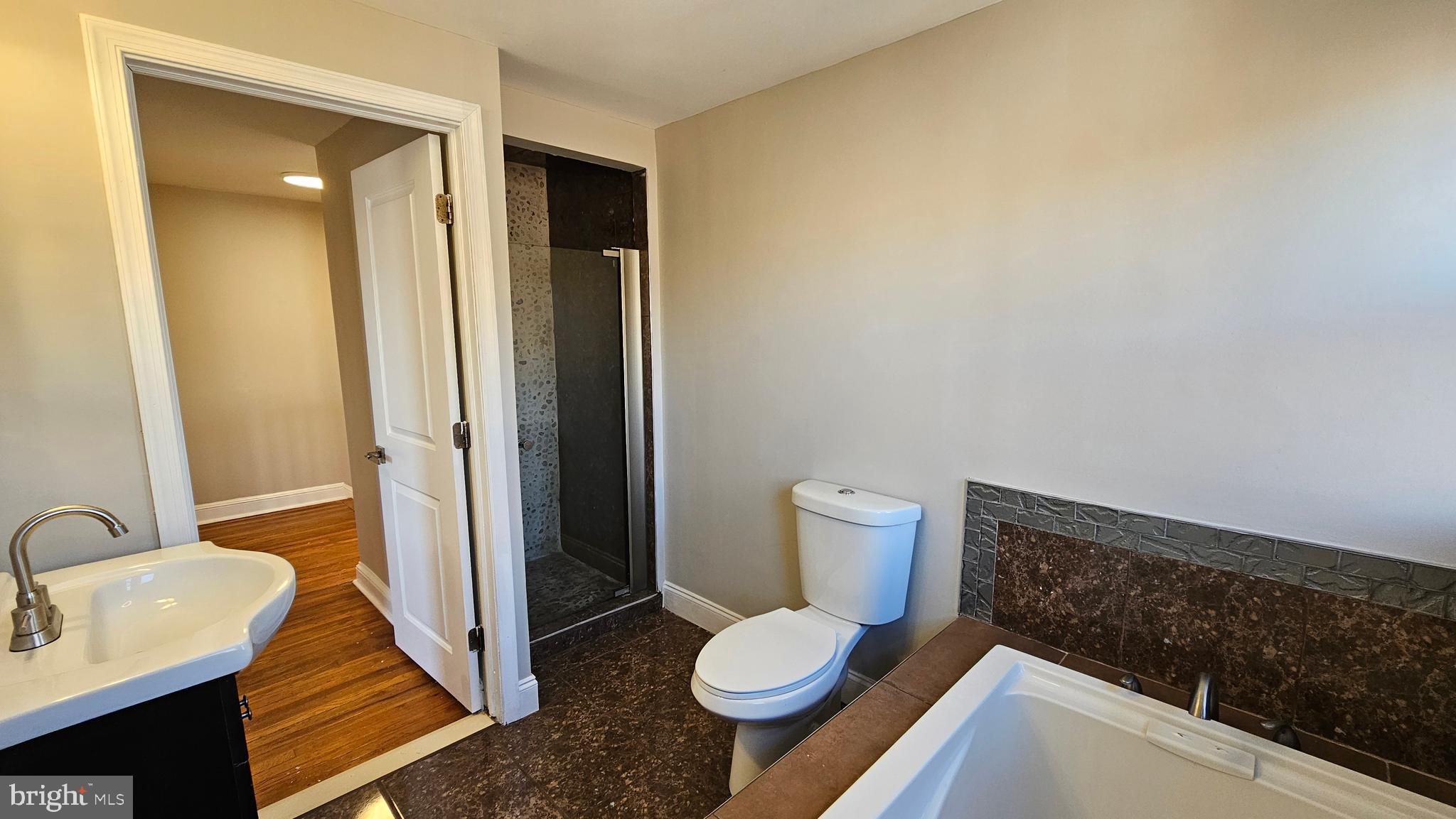 825 Laurel Road Lansdowne, PA 19050 - Photo 25 of 35 a bathroom with a sink and toilet
