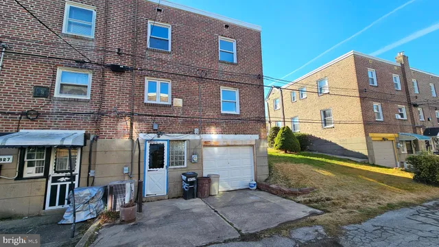 a view of a brick building with many windows