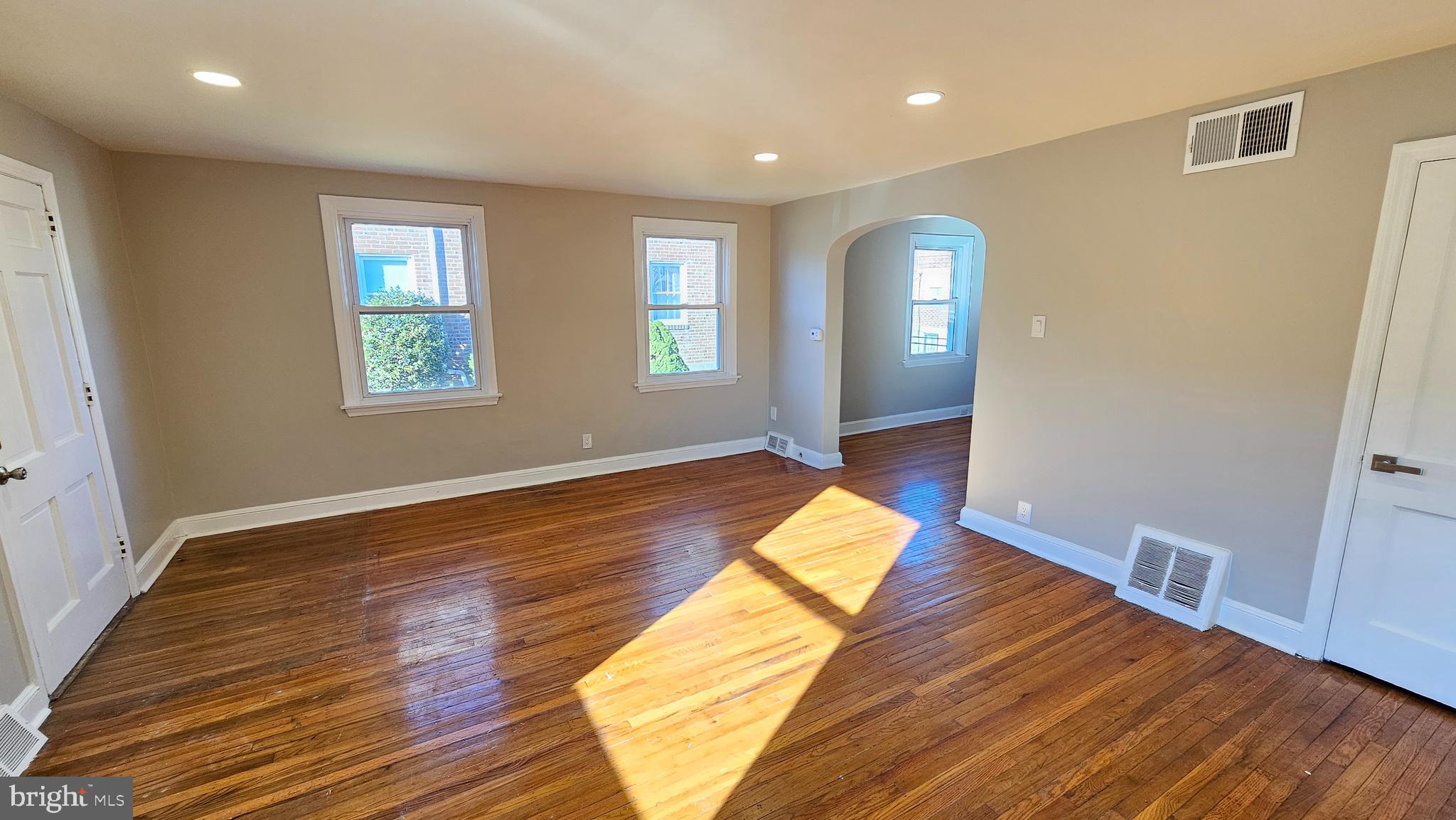 825 Laurel Road Lansdowne, PA 19050 - Photo 7 of 35 a view of empty room with wooden floor and fan